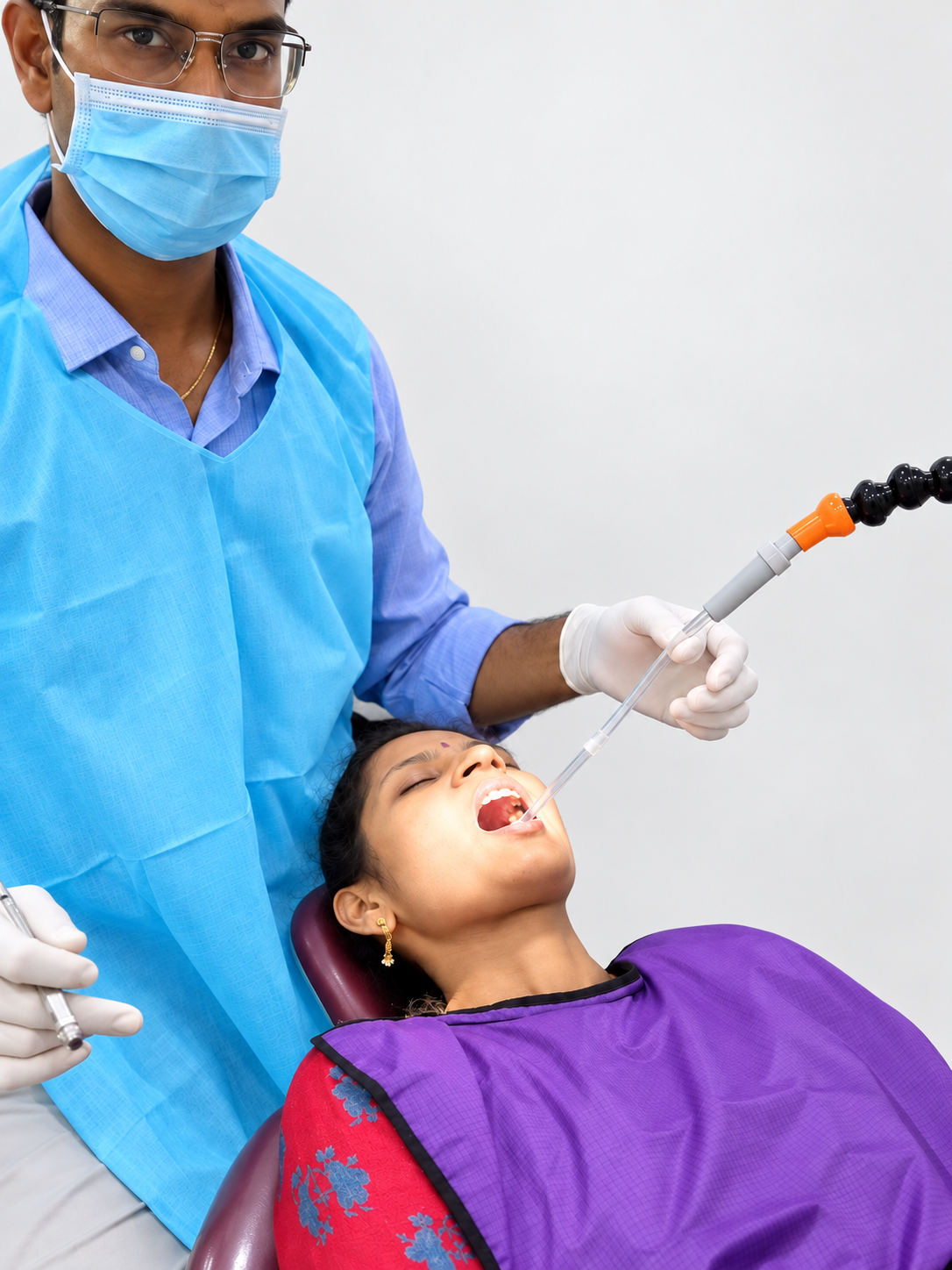 Dentist positioning the saliva ejector with the Oraflow Assist arm