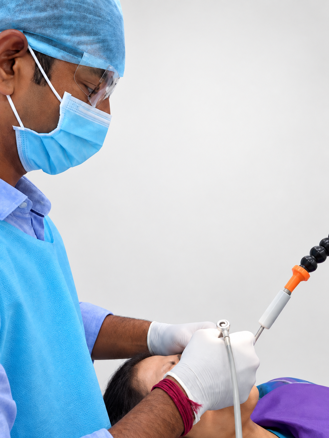 Dentist working solo in the clinic with Oraflow Assist